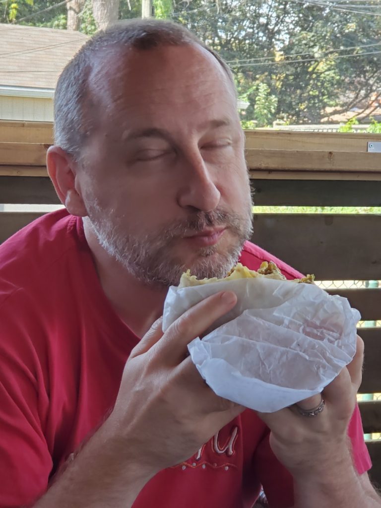 Michael enjoying roti